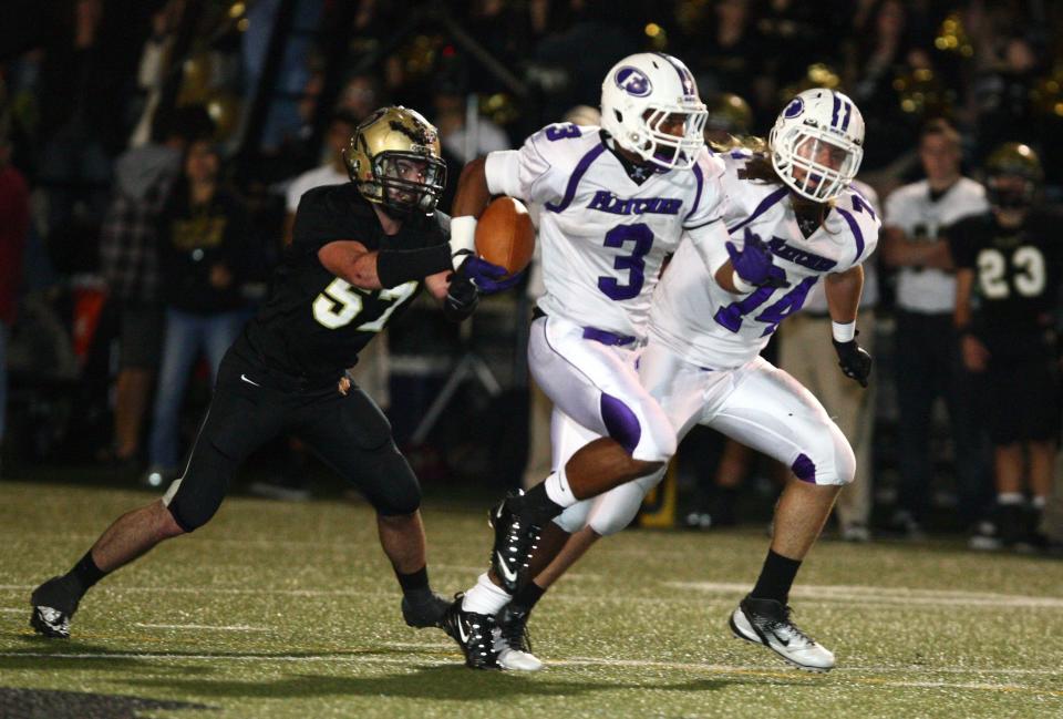 Fletcher running back Jamari Smith (3) races away from the Tampa Plant defense in a 2011 playoff game. Fletcher's consistency has led the Senators to the most wins since 2000 among Gateway Conference football teams.