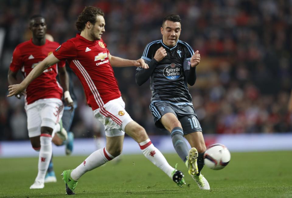 <p>Manchester United’s Daley Blind in action with Celta Vigo’s Iago Aspas </p>