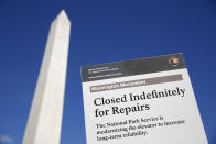 A sign greets visitors outside of the Washington Monument during a press preview tour ahead of the monument's official reopening, Wednesday, Sept. 18, 2019, in Washington. The monument, which has been closed to the public since August 2016, is scheduled to re-open Thursday, Sept. 19. (AP Photo/Patrick Semansky)