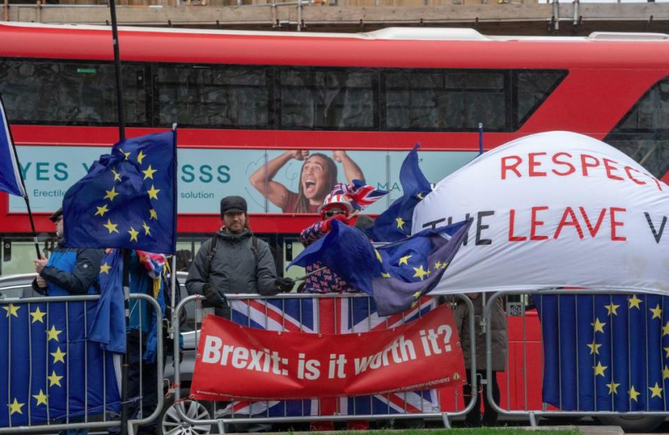 Pro and anti-Brexit demonstrators outside Parliament (PA)