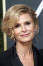 <p>Kyra Sedgwick's full side-swept bangs are a flattering way to prevent an <a href="https://www.goodhousekeeping.com/beauty/hair/tips/g1800/celebrity-hairstyles-updo/" rel="nofollow noopener" target="_blank" data-ylk="slk:updo;elm:context_link;itc:0;sec:content-canvas" class="link ">updo</a> from looking severe.</p>