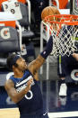 Minnesota Timberwolves' D'Angelo Russell (0) lays up a shot against the Memphis Grizzlies in the second half of an NBA basketball game, Wednesday, Jan. 13, 2021, in Minneapolis. The Grizzlies won 118-107. Russell scored 25 points. (AP Photo/Jim Mone)