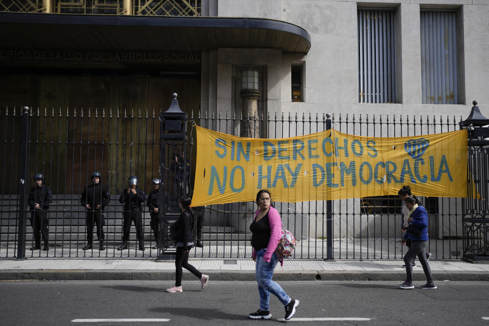 A sign reads in Spanish "Without rights there is no democracy" outside the Human Capital Ministry in Buenos Aires, Argentina, Wednesday, April 10, 2024, on the sidelines of an anti-government protest. (AP Photo/Natacha Pisarenko)