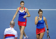 Tennis - Fed Cup Final - France v Czech Republic - Strasbourg, France - 13/11/16 - Czech Republic's Karolina Pliskova and Barbora Strycova celebrate the win of the first set with Czech Republic's team Captain Petr Pala. REUTERS/Vincent Kessler