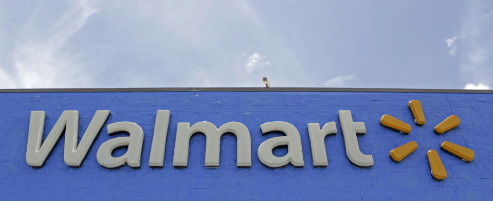 FILE - This June 1, 2017, file photo shows a Walmart store in Hialeah Gardens, Fla. Ford and Walmart are partnering to test a self-driving grocery delivery service. Ford will work with Walmart to determine what goods it can feasibly transport and figure out what issues may need to be addressed to successfully deliver orders via self-driving vehicles. (AP Photo/Alan Diaz, File)