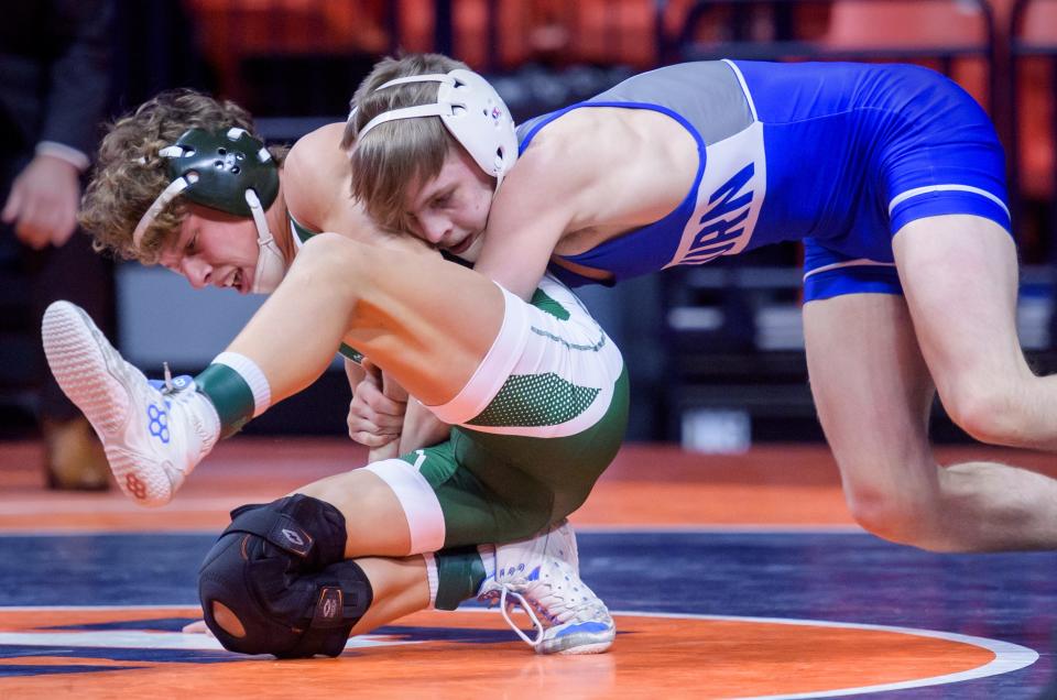 Auburn's Joey Ruzic puts a hold on Coal City's Brody Widlowski in the 126-pound match of the Class 1A state wrestling championships Saturday, Feb. 17, 2024 at the State Farm Center in Champaign. Ruzic took the title with a 6-1 decision.