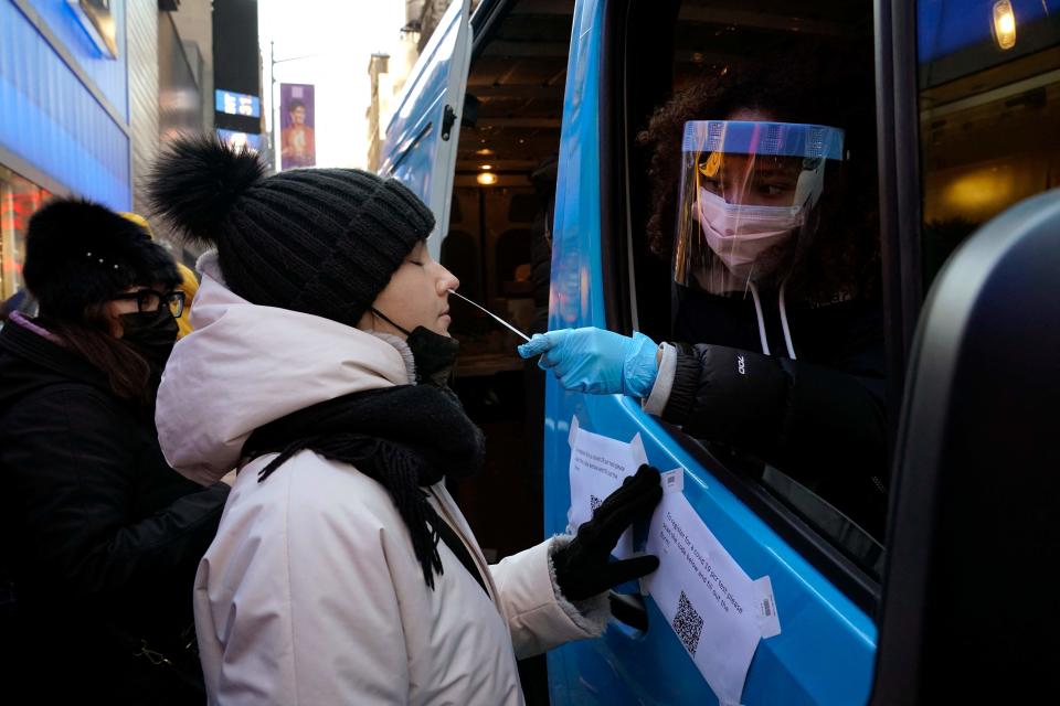 People get tested for the coronavirus at a van in Times Square on Jan. 4 in New York City.