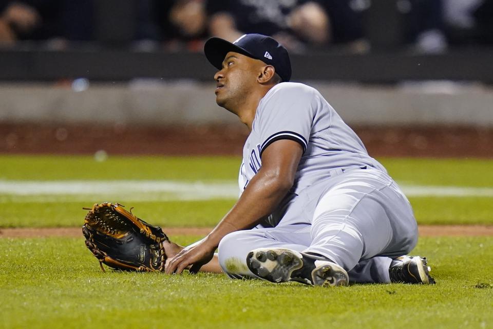 New York Yankees relief pitcher Wandy Peralta reacts after New York Mets' Brandon Nimmo singled on a ground ball to him during the ninth inning of a baseball game Wednesday, July 27, 2022, in New York. The Mets won 3-2. (AP Photo/Frank Franklin II)