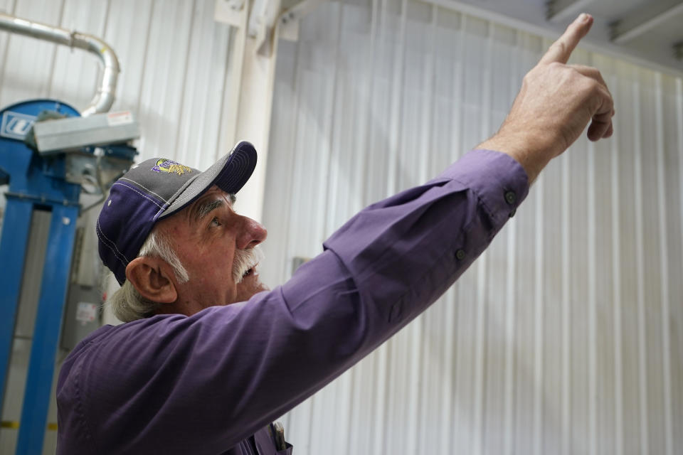 Adrian Polansky, a farmer and former executive director of the USDA’s Farm Service Agency office in Kansas during the Obama administration, points out new equipment at his seed processing plant near Belleville, Kan., Friday, March 5, 2021. More than a year after two U.S. Department of Agriculture research agencies were moved from the nation’s capital to Kansas City, they remain critically understaffed and some farmers are less confident in the work they produce. (AP Photo/Orlin Wagner)