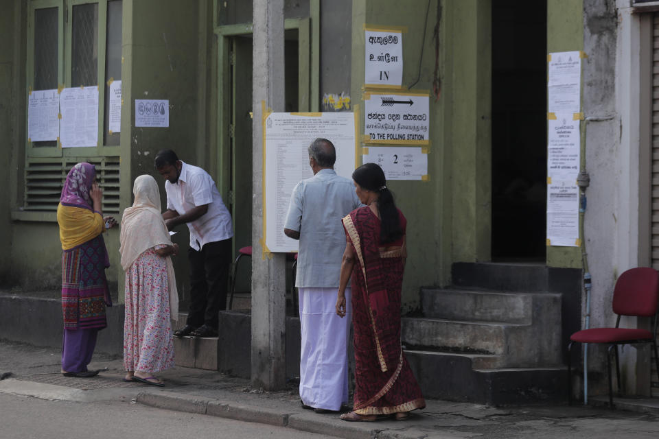 Sri Lankan ethnic Tamils and Muslims enter a polling station to cast their votes during the presidential election in Colombo, Sri Lanka, Saturday, Nov. 16, 2019. Polls opened in Sri Lanka’s presidential election Saturday after weeks of campaigning that largely focused on national security and religious extremism in the backdrop of the deadly Islamic State-inspired suicide bomb attacks on Easter Sunday. (AP Photo/Eranga Jayawardena)