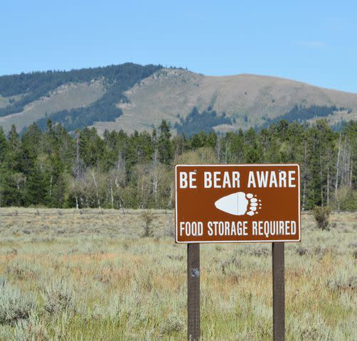 <p>Getty</p> A 'Be Bear Aware Food Storage Required' sign in Grand Teton National Park.