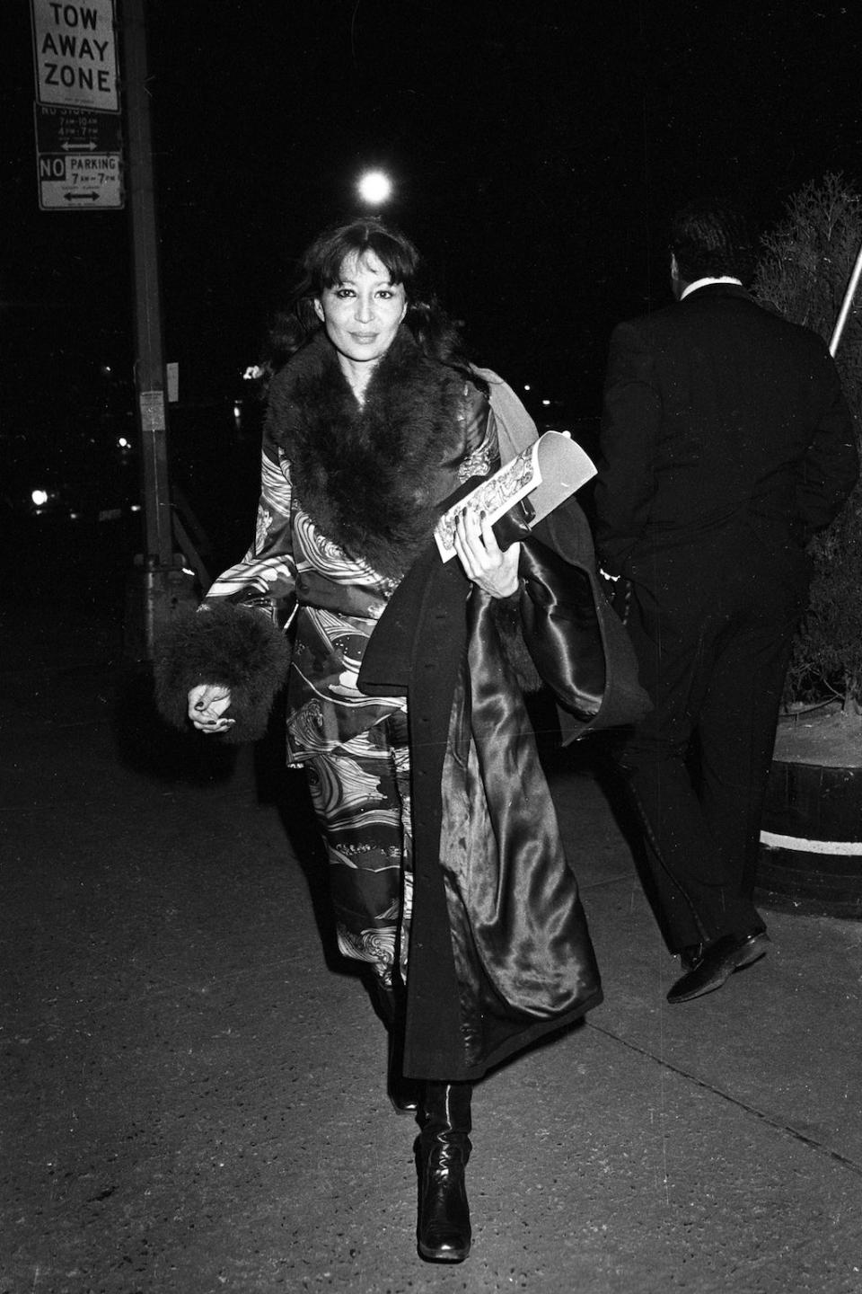 China Machado attending a dinner party in a fabulous coat