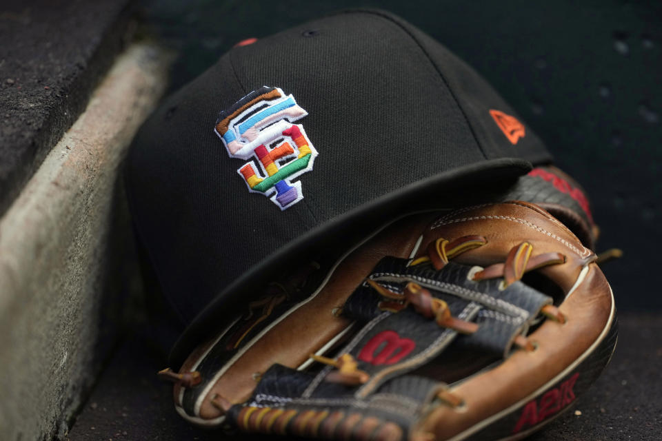 A rainbow colored logo is shown on a San Francisco Giants hat during the team's Pride Day in a baseball game between the Giants and the Chicago Cubs in San Francisco, Saturday, June 10, 2023. Almost 80 years after Jackie Robinson broke the majors’ color barrier in a landmark moment for the American civil rights movement, the dueling expressions of LGBTQ+ support and seeming rejection recalled the question of when the big leagues might welcome their first active openly gay player. (AP Photo/Jeff Chiu)