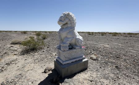 A statue of a lion is pictured along Route 66 near Amboy, California; part of the newly named Mojave Trails National Monument, March 17, 2015. REUTERS/Sam Mircovich