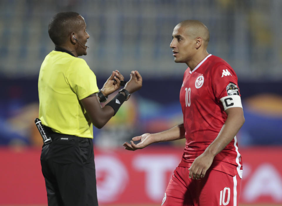 Tunisia's Wahbi Khazri talks to a raferee during the African Cup of Nations semifinal soccer match between Senegal and Tunisia in 30 June stadium in Cairo, Egypt, Sunday, July 14, 2019. (AP Photo/Hassan Ammar)