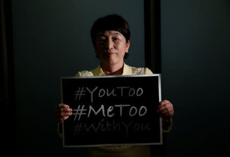 Social Democratic Party's lawmaker Mizuho Fukushima poses with the #MeToo banner during an interview with Reuters in Tokyo, Japan, April 24, 2018. Picture taken on April 24, 2018. REUTERS/Toru Hanai