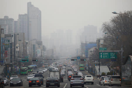 Vehicles move on a road on a polluted day in Seoul, South Korea, March 12, 2019. REUTERS/Kim Hong-ji