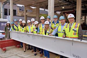Philadelphia City Council member Mark Squilla joins members of the Broad & Noble development team, including Toll Brothers Apartment Living, Sundance Bay, and Clemens Construction Company, for a ceremonial beam-signing before the beam was hoisted to the top of the construction site.