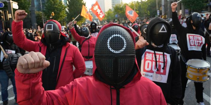 Unions workers in Seoul, South Korea, wear masks and costumes inspired by the Netflix original Korean series &quot;Squid Game.&quot;