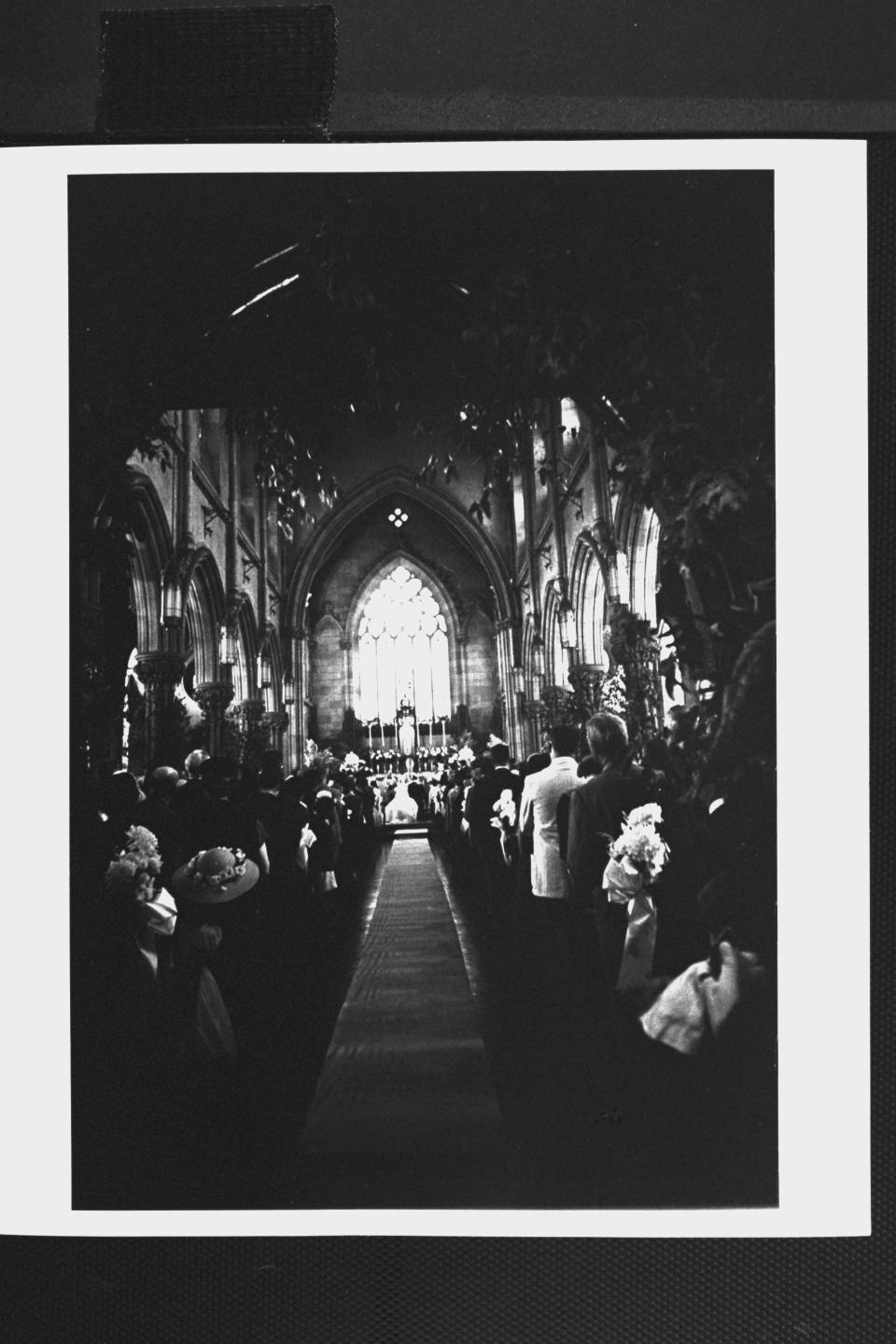 Six hundred guests stand listening to wedding vows of Sen. John F. Kennedy and his bride Jacqueline. (Photo by Lisa Larsen//Time Life Pictures/Getty Images)