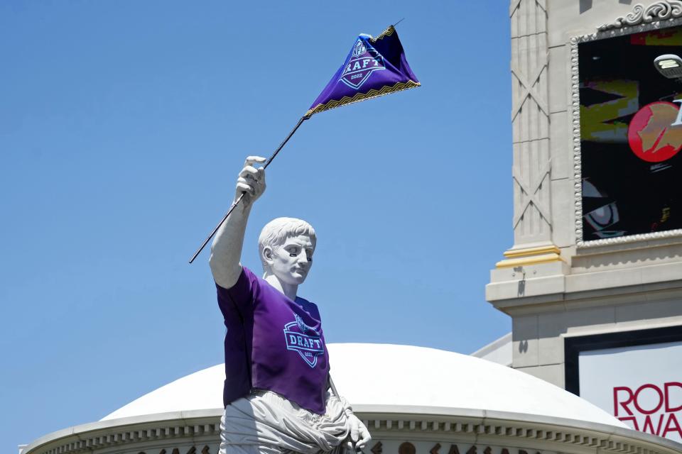 A statue of Julius Caesar outside Caesars Palace was sporting an NFL draft shirt and waving an NFL draft flag before the first round Thursday.