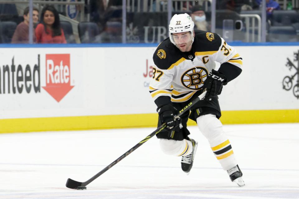 Bruins center Patrice Bergeron skates against the New York Islanders.