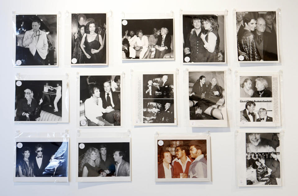 This Jan. 16, 2013 photo shows mounted photographs taken at Studio 54 on display in West Palm Beach, Fla. Memorabilia from the famed 1970s club is hitting the auction block in Florida. The private collection of co-founder Steve Rubell is being sold Saturday in West Palm Beach. (AP Photo/Alan Diaz)