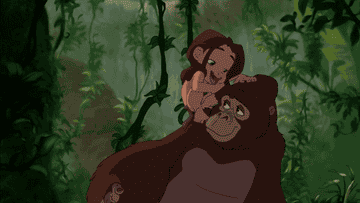 Tarzan as a kid hangs off his mother ape