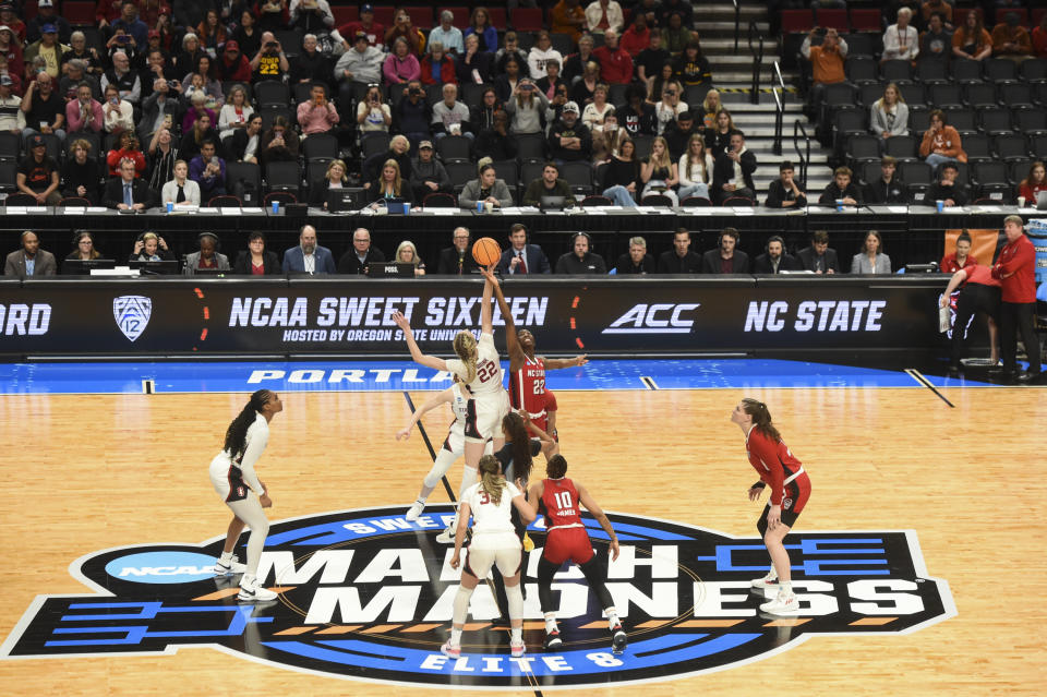 Stanford forward Cameron Brink and North Carloina State guard Saniya Rivers try to get the ball during a tip-off during a Sweet 16 college basketball game in the women's NCAA Tournament against Stanford, Friday, March 29, 2024, in Portland, Ore. (AP Photo/Steve Dykes)