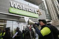 Larry Born, a former Walmart employee from Park Forest, Illinois, takes part in a demonstration for higher wages and better working conditions, outside of a Walmart during Black Friday shopping in Chicago November 28, 2014. REUTERS/Andrew Nelles