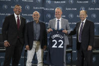 FILE - Minnesota Timberwolves Ownership Group Alex Rodriguez, left, Marc Lore,, second from left, and Glen Taylor, right, pose for a photo with Timberwolves new President of Basketball Operations Tim Connelly (holding jersey) in Minneapolis, Tuesday, May 31, 2022. The ownership transfer of the Timberwolves slammed to a halt when Taylor declared on Thursday, March 27, 2024, he won't take the final step of his drawn-out $1.5 billion deal to hand Marc Lore and Alex Rodriguez the majority stake because they didn't meet all of the deadlines in the sale conditions. (Jerry Holt/Star Tribune via AP, File)