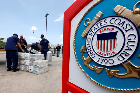 FILE PHOTO: U.S. Coast Guards display part of the 1280 kg (2822 pounds) of cocaine, worth an estimated $37 million, seized in a routine patrol during a media presentation in San Juan, May 6, 2014. REUTERS/Ana Martinez/File Photo