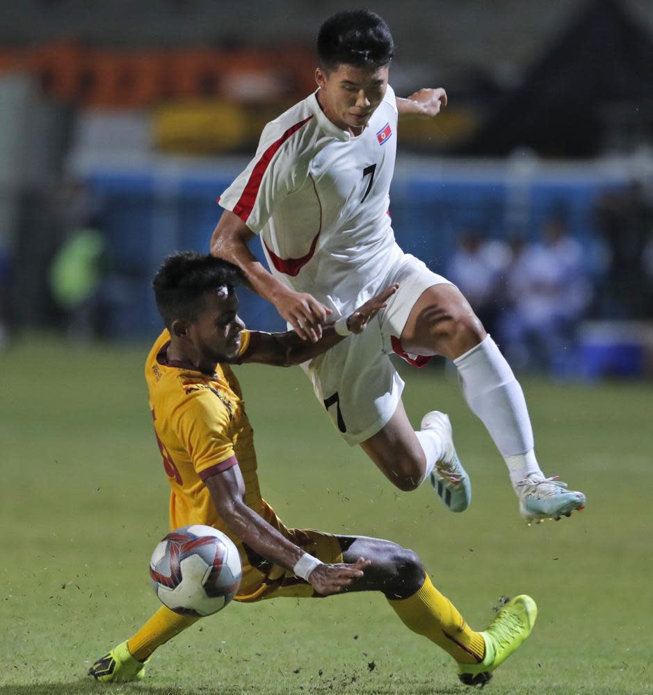 Han Kwang-song leaps over Sri Lanka’s Manaram Perera during North Korea’s 1-0 win last week.