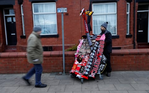 Premier League - Manchester United vs Newcastle United - Old Trafford scarves on sale - Credit: Getty