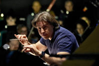 Guest Conductor Gavriel Heine leads Ballet Arizona musicians in a rehearsal for the "Nutcracker", Thursday, Dec. 7, 2023, in Phoenix prior to an upcoming performance. A pit full of musicians is part of the tradition of the holiday staple for Ballet Arizona and many other productions around the world. Shows use recordings as they weather costs or crises like recessions. But fans, musicians and the unions that represent them say the live music brings an unseen signature to each show. (AP Photo/Matt York)