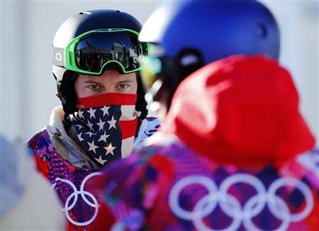 U.S. snowboarder White waits in line during a breakdown of the chairlift at snowboard slopestyle training for the 2014 Sochi Winter Olympics in Rosa Khutor