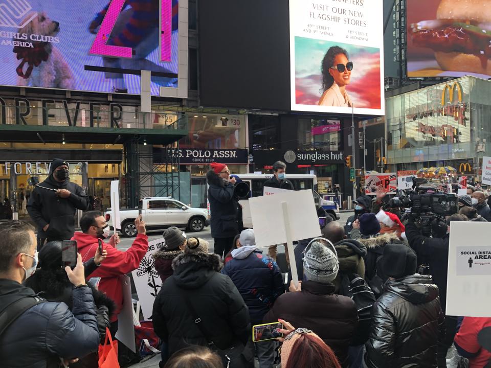 Marriott Marquis worker Brian Richards (left) protested hotel employees' treatment by hotel management alongside State Sen. Brad Hoylman (right) on Dec. 23, 2020.