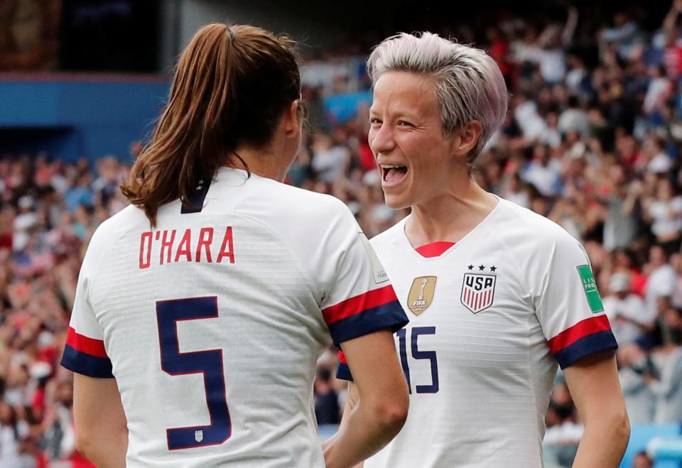 Rapinoe (right) celebrates with Kelley O'Hara during the 2019 World Cup.