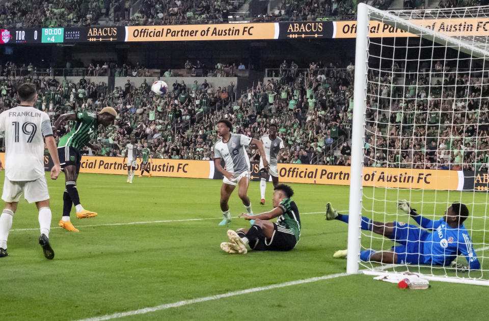 Austin FC forward Gyasi Zardes, second from the left, heads the ball for a goal during the second half of an MLS soccer game against Toronto FC, Saturday, May 20, 2023, in Austin, Texas. (AP Photo/Michael Thomas)