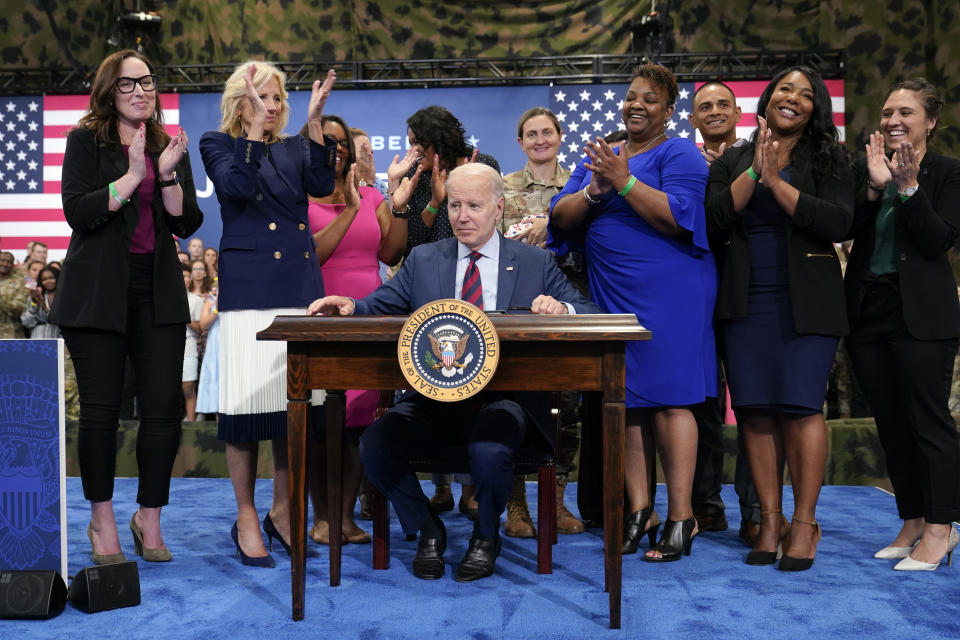 First lady Jill Biden and others applaud after President Joe Biden signed an executive order during a visit to Fort Liberty, N.C., Friday, June 9, 2023. Biden signed an executive order on Friday that aims to bolster job opportunities for military and veteran spouses whose careers are often disrupted by their loved ones' deployments, telling them "we never forget that you've also answered the nation's call." (AP Photo/Susan Walsh)