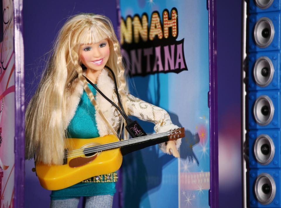 FILE - In this Tuesday, Oct. 2, 2007, file photo, A Hannah Montana Singing Doll and Pop Star stage are shown at the Toy Wishes Holiday Preview in New York. Play Along’s Hannah Montana doll, based on Miley Cyrus’ hit Disney character, was on everyone’s “hot toy” list in 2007 and 2008. (AP Photo/Mark Lennihan)