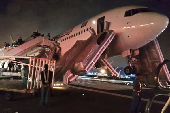 A plane is pictured after an emergency landing at Medina airport January 5, 2014. Twenty nine people were injured when a Saudi Arabian Airlines (Saudia) Boeing 767-300ER made an emergency landing at Medina airport in the west of the country early on Sunday, the General Authority of Civil Aviation said. REUTERS/Stringer (SAUDI ARABIA - Tags: DISASTER TRANSPORT) - RTX172UW