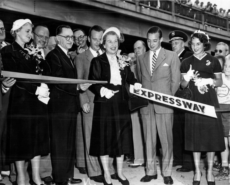 Eleanor Clay Ford cuts a ribbon in 1959 at the grand opening of the Edsel Ford Expressway, named for her late husband.