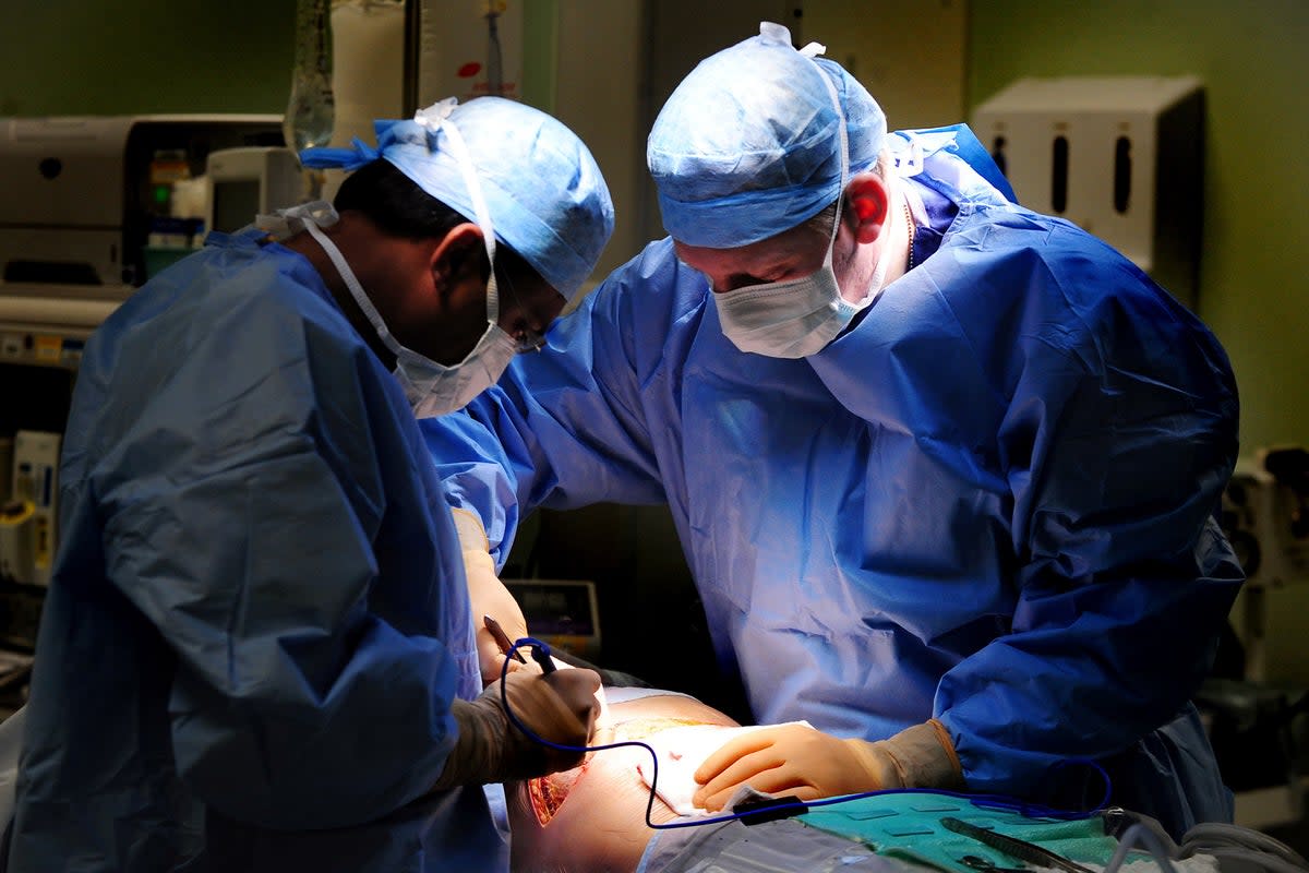 Medics in surgery (File photo)  (PA Archive)