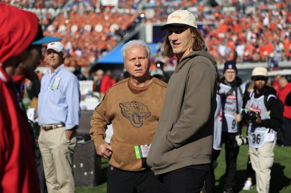 Jacksonville Jaguars head of security Skip Richardson, center left, looks on as quarterback Trevor Lawrence talks on the Clemson sideline during the third quarter of an NCAA football matchup in the TaxSlayer Gator Bowl Friday, Dec. 29, 2023 at EverBank Stadium in Jacksonville, Fla. The Clemson Tigers edged the Kentucky Wildcats 38-35. [Corey Perrine/Florida Times-Union]