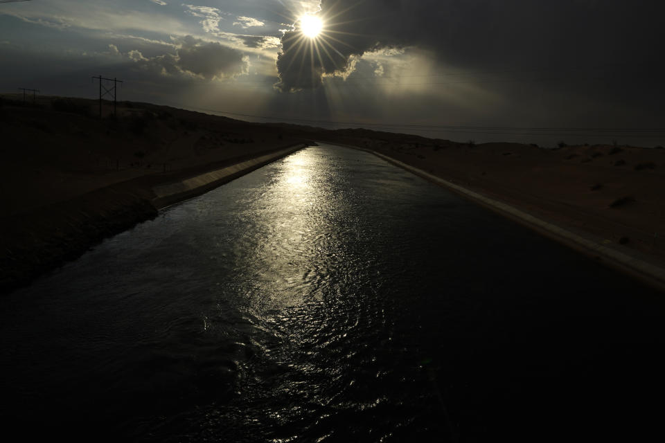 Water flows along the All-American Canal Saturday, Aug. 13, 2022, near Winterhaven, Calif. In November 1922, seven land-owning white men brokered a deal to allocate water from the Colorado River, which winds through the West and ends in Mexico. During the past two decades, pressure has intensified on the river as the driest 22-year stretch in the past 1,200 years has gripped the southwestern U.S. (AP Photo/Gregory Bull)