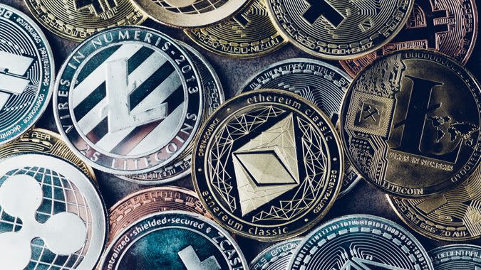 Crypto currency background with various of shiny silver and golden physical cryptocurrencies symbol coins, Bitcoin, Ethereum, Litecoin, zcash, ripple.