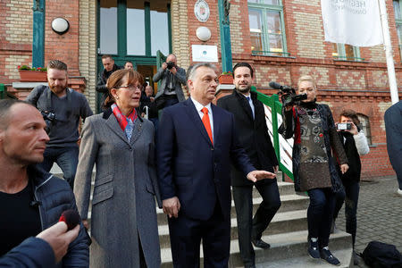 Current Hungarian Prime Minister Viktor Orban and his wife Aniko Levai leave a polling station during Hungarian parliamentary election in Budapest, Hungary, April 8, 2018. REUTERS/Bernadett Szabo