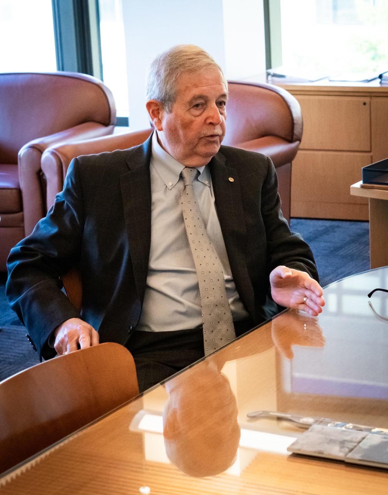 Jesús Garza takes a quick morning meeting in his City Hall office in November.