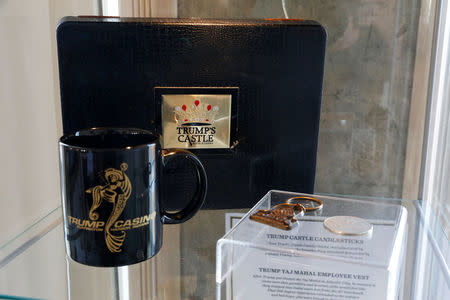 A Trump Castle gambling chips box, Trump Casino coffee cup, Trump Taj Mahal key chain, and Trump Castle gaming token are displayed at The Trump Museum near the Republican National Convention in Cleveland, Ohio, U.S., July 19, 2016. REUTERS/Lucas Jackson